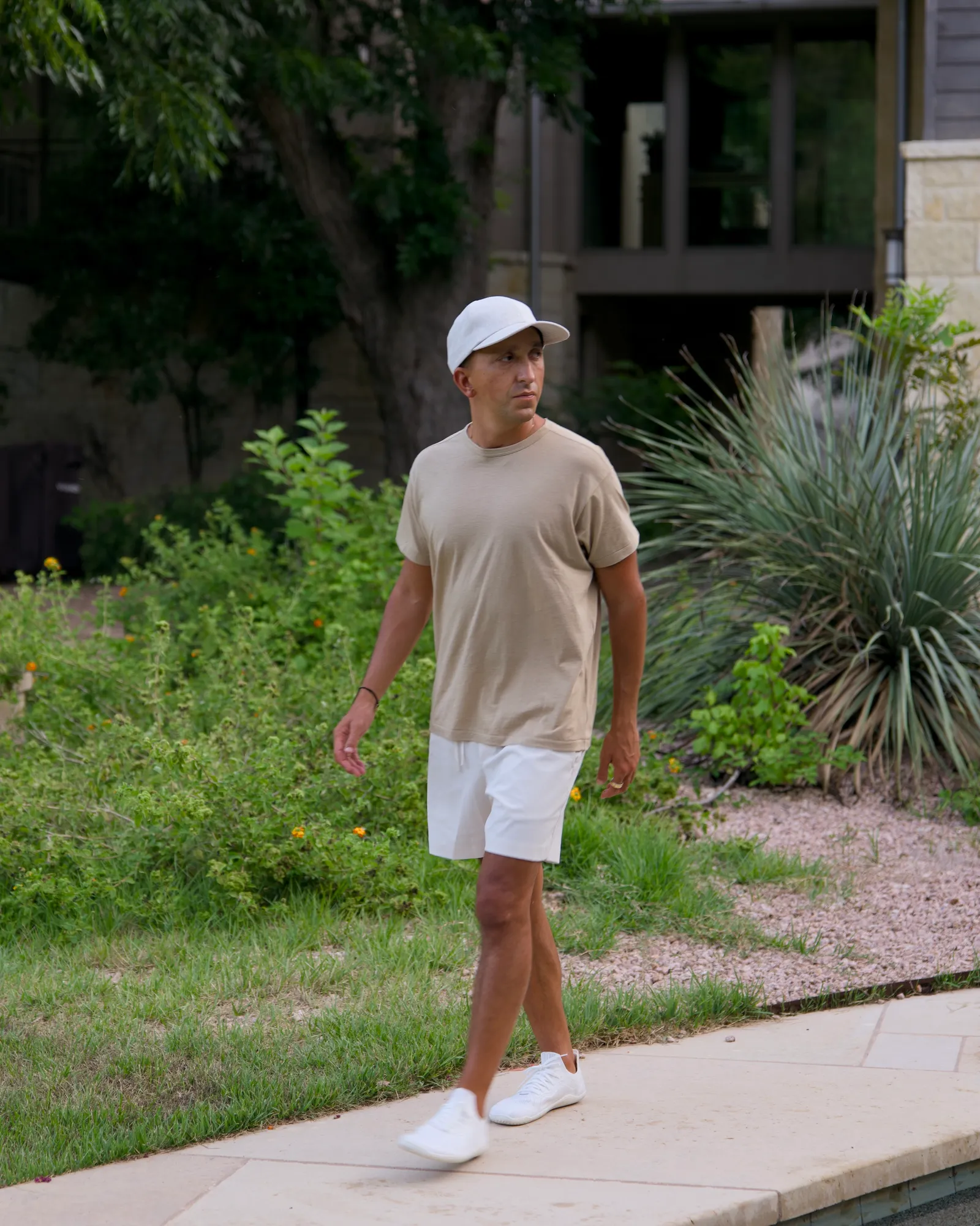 Kyle Lasota walking through the garden at home